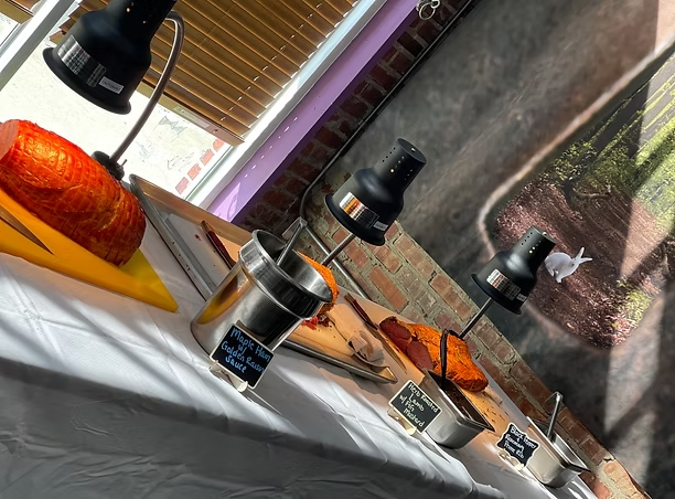 Carving station with heat lamps and slow-roasted meats